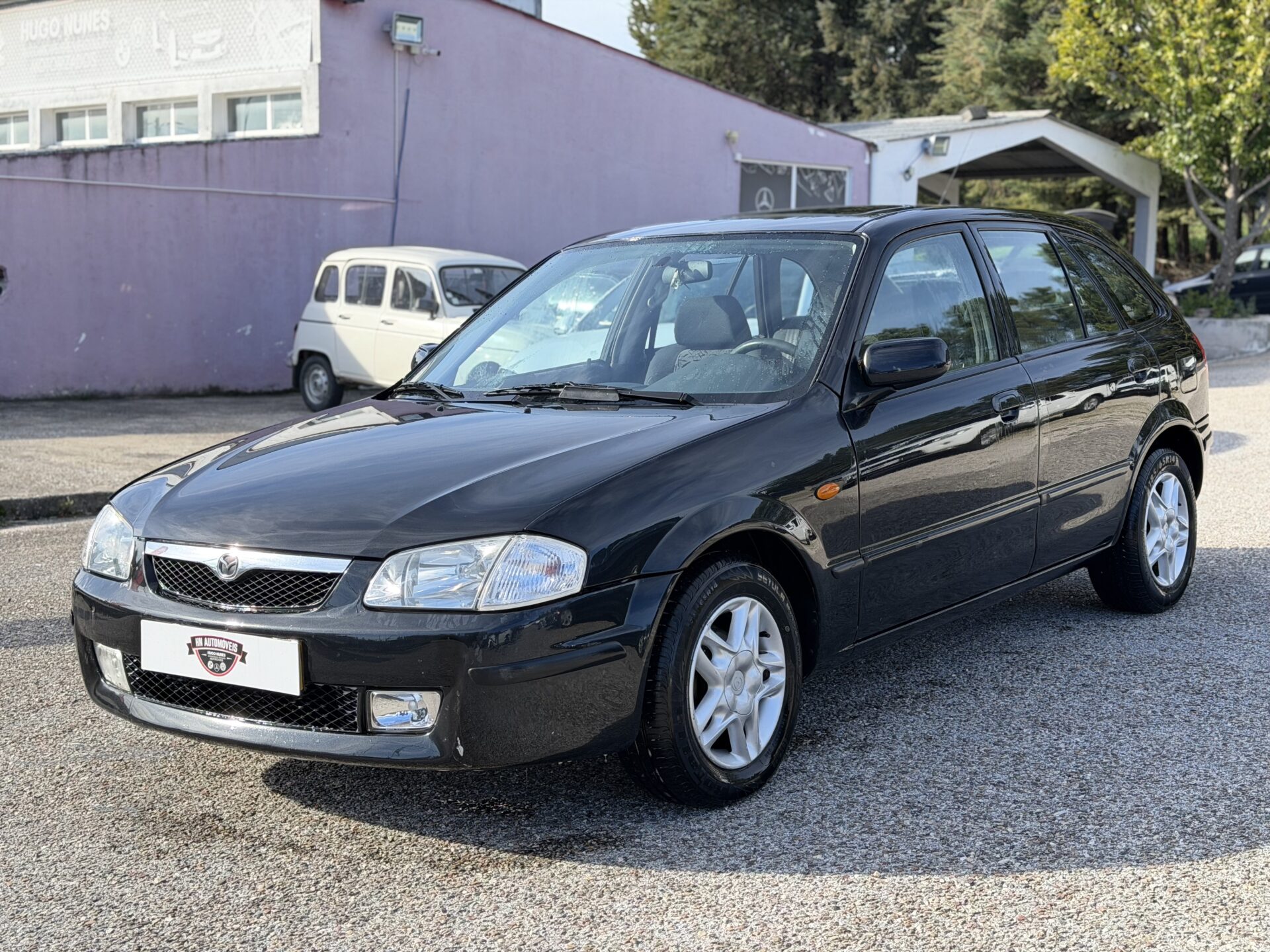 
								Mazda 323 F total									
